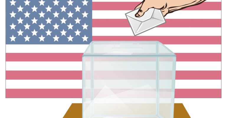 An image of a hand casting a ballot in a box against the backdrop of the US flag