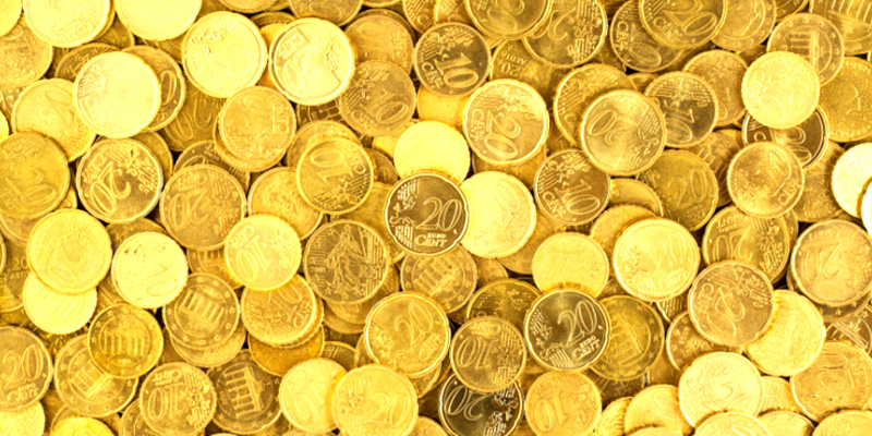 A pile of gold coins placed in a gold IRA account