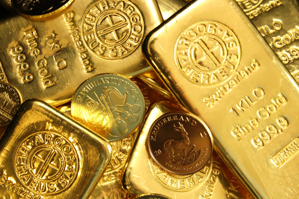 A close up of gold bars and coins