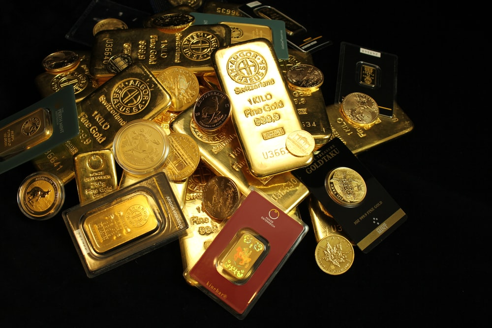 Stacked Gold assets of bullion bars and coins
