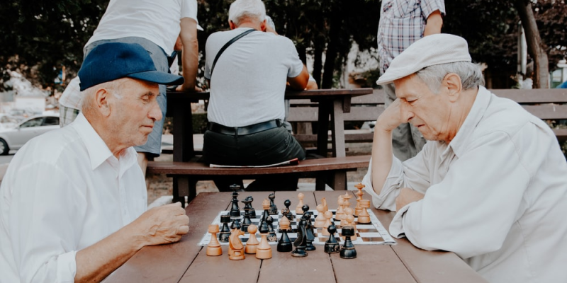 Two retired men playing chess