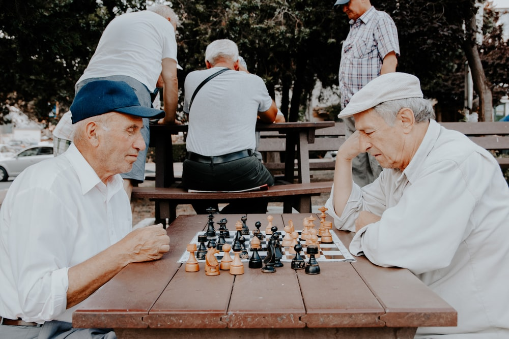 Two retired men playing chess