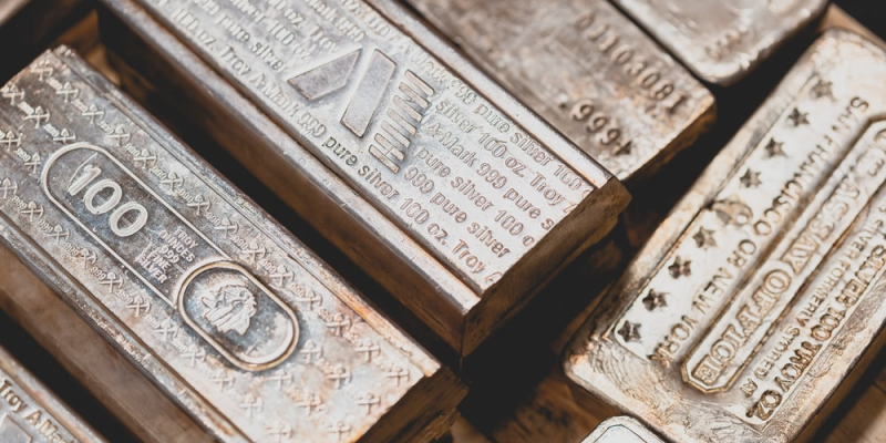 A close up of stacked silver bars