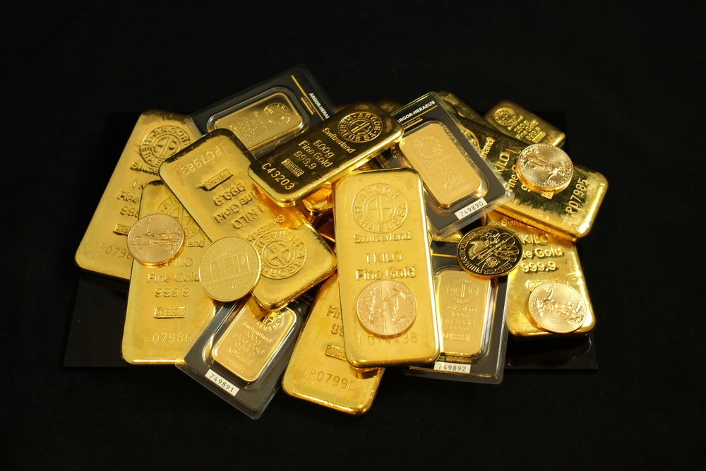 A stack of gold bullion coins and bars