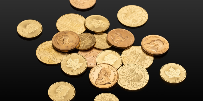 Several gold coins in the dark