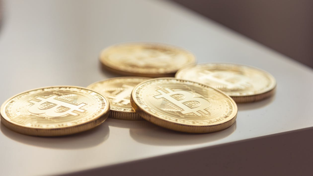 Gold Bitcoin coins in minted condition