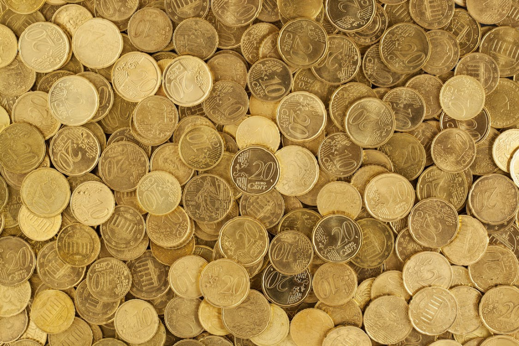 A pile of gold coins placed in a gold IRA account