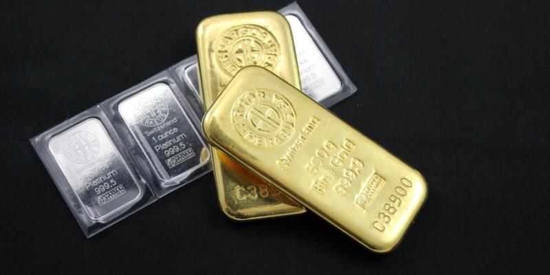 A stack of silver and gold bullion bars