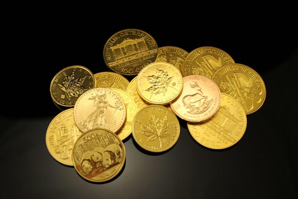 A bunch of gold coins with unique designs