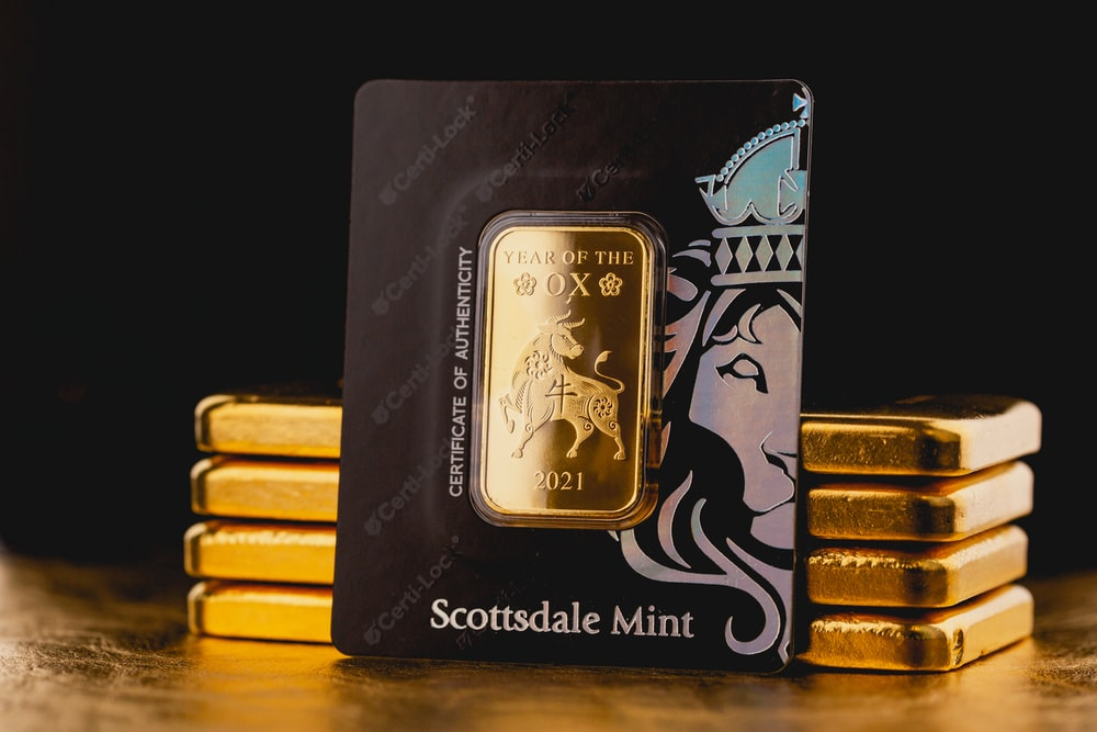 A stack of minted and packed gold bullion bars