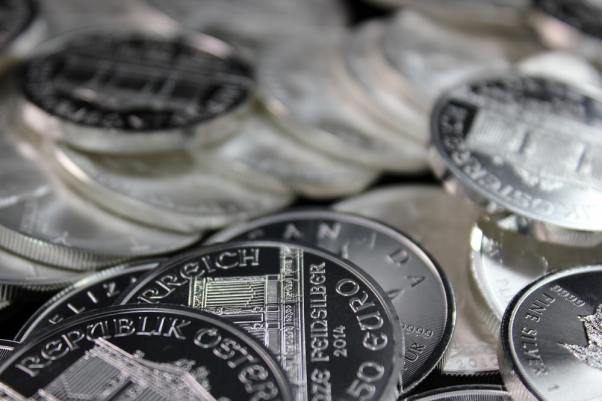 A close-up image of several platinum coins.