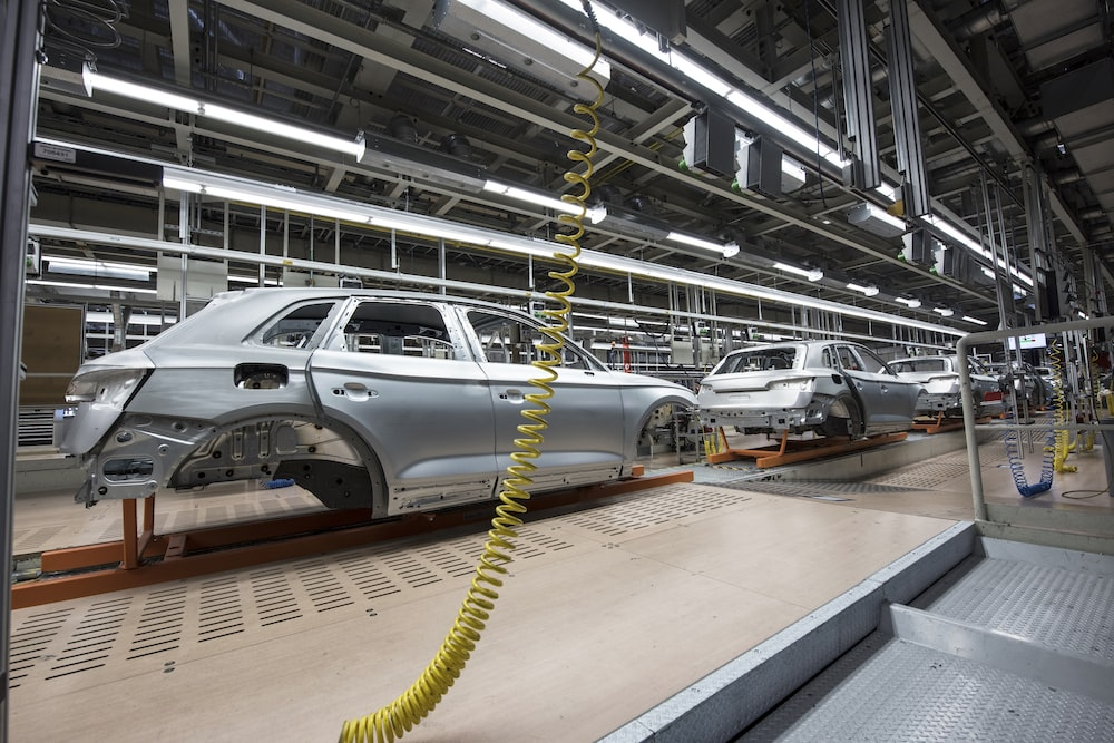 Cars being made on a production site.