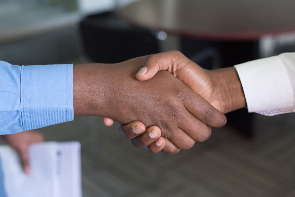 Cropped image of two people’s handshake