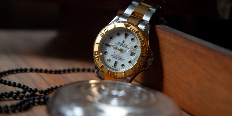 A photo of a gold and silver watch
