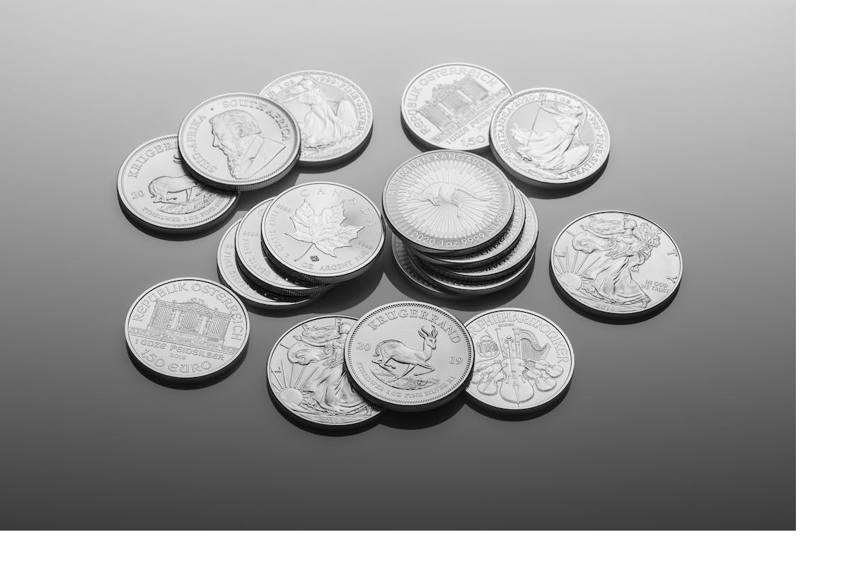 Multiple coins on a gray surface
