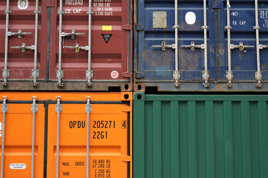 Shipping containers carry commodities.