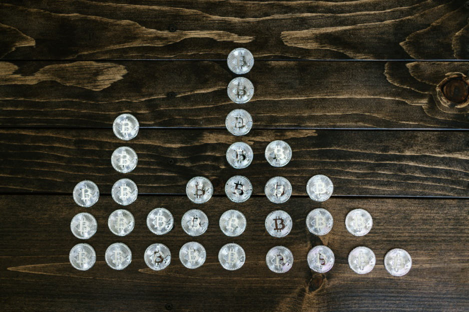 Silver coins on a wooden surface.