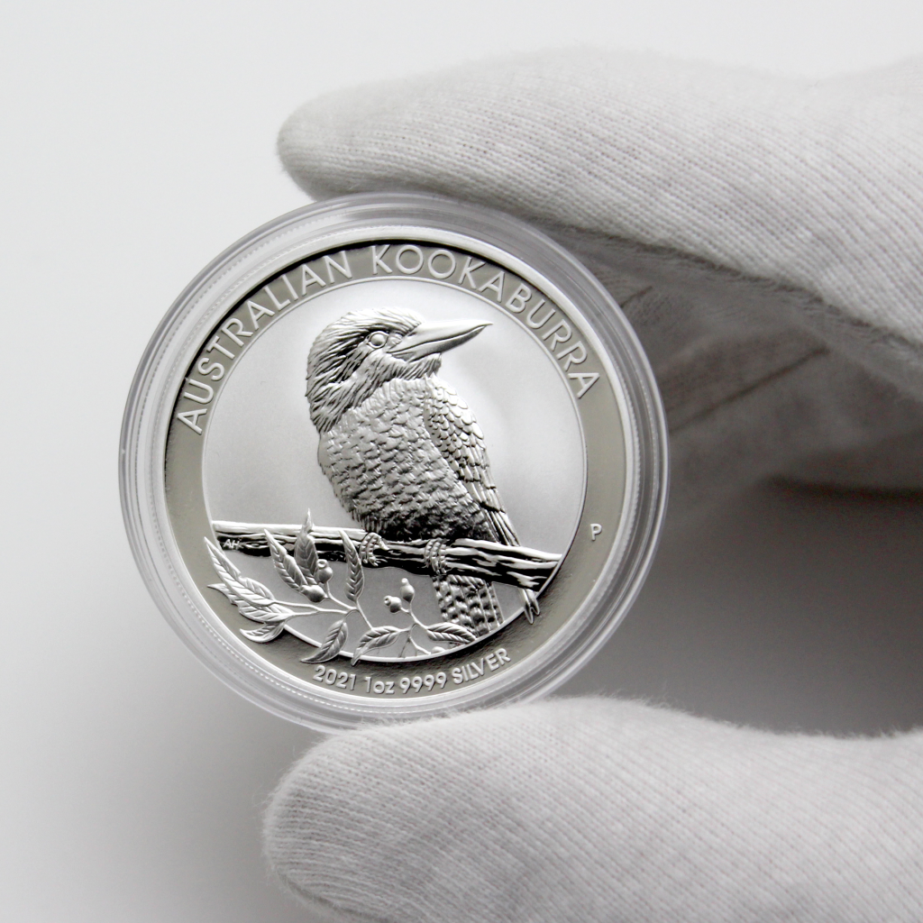 silver coin in close-up photography