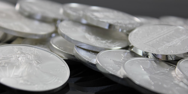 Pile of silver coins from Royal Canadian Mint, US Mint.