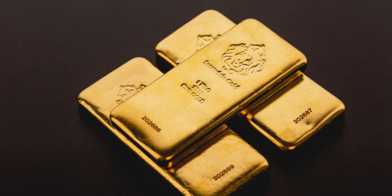 three gold bullion bars.