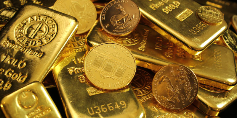 close-up photo of gold bars and coins