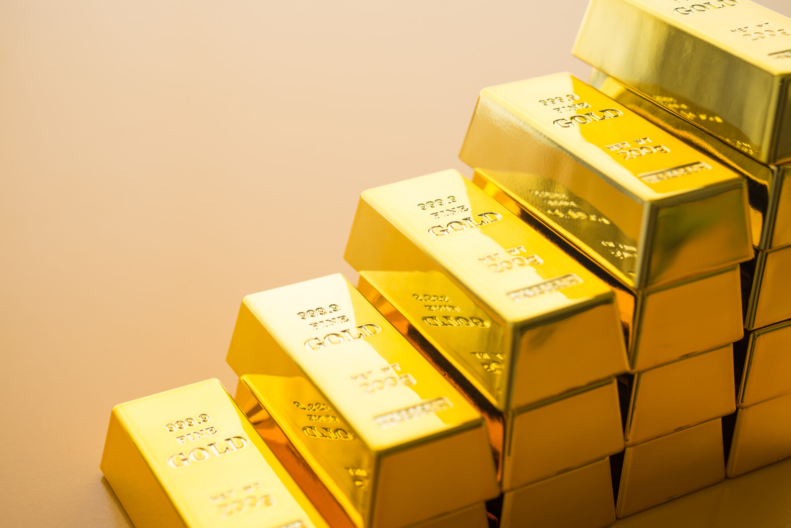 Stack gold bars as rise up stairs on yellow background. Gold price increase, investment in commodity market trading, etf, risk mnagement concept. Gold is safe haven in economy crisis, war.