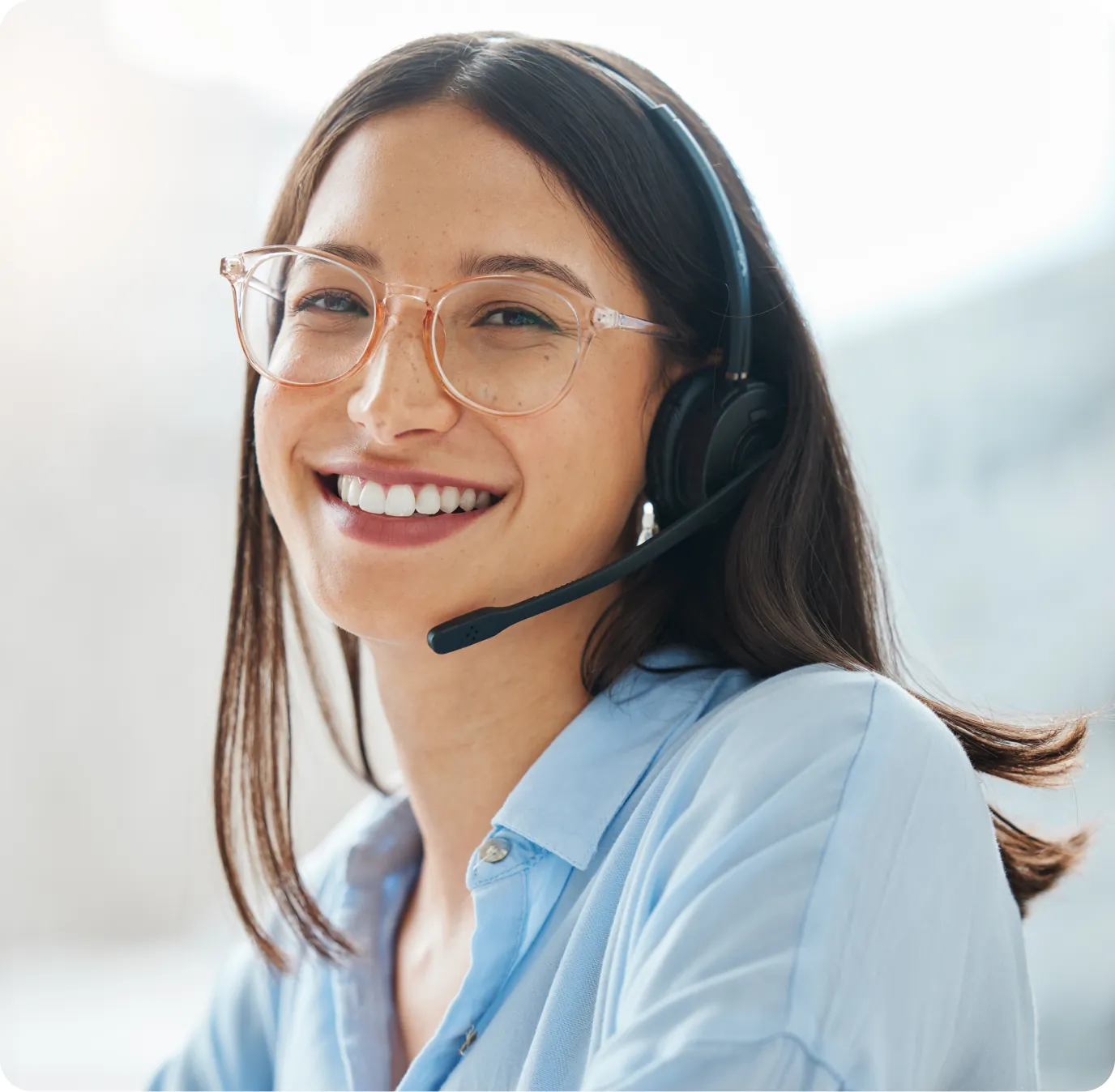 Smiling Orion specialist wearing a headset